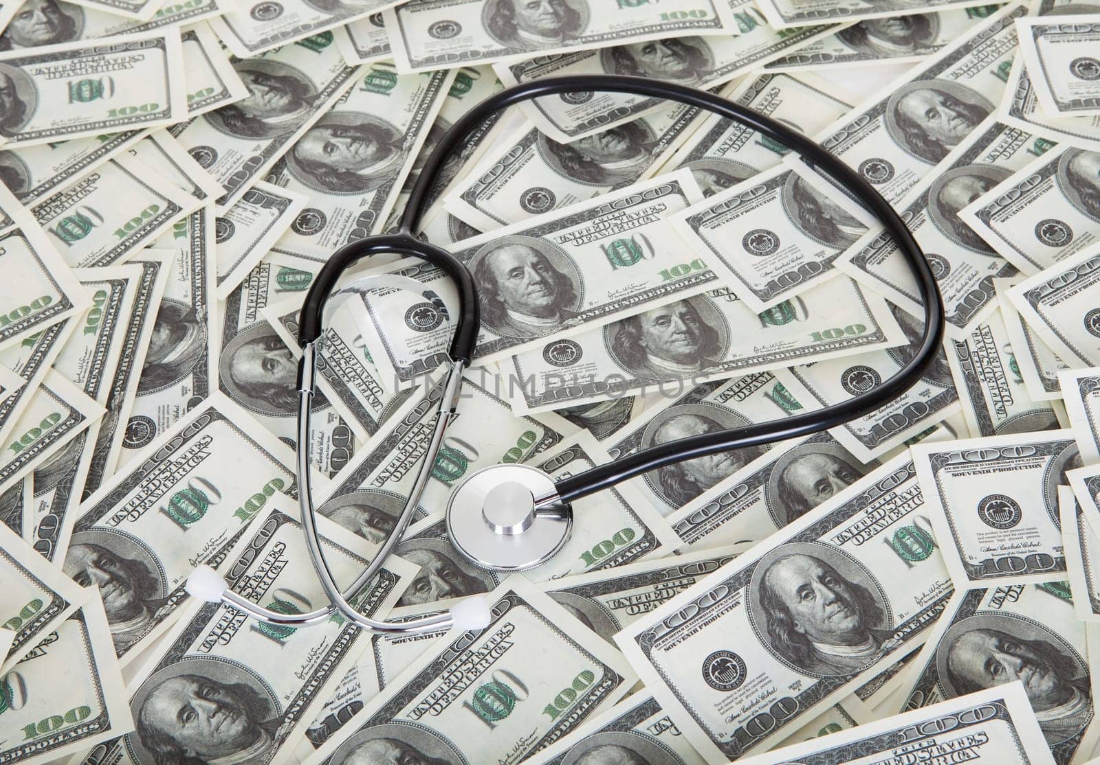 Photos of stethoscope and american dollar notes