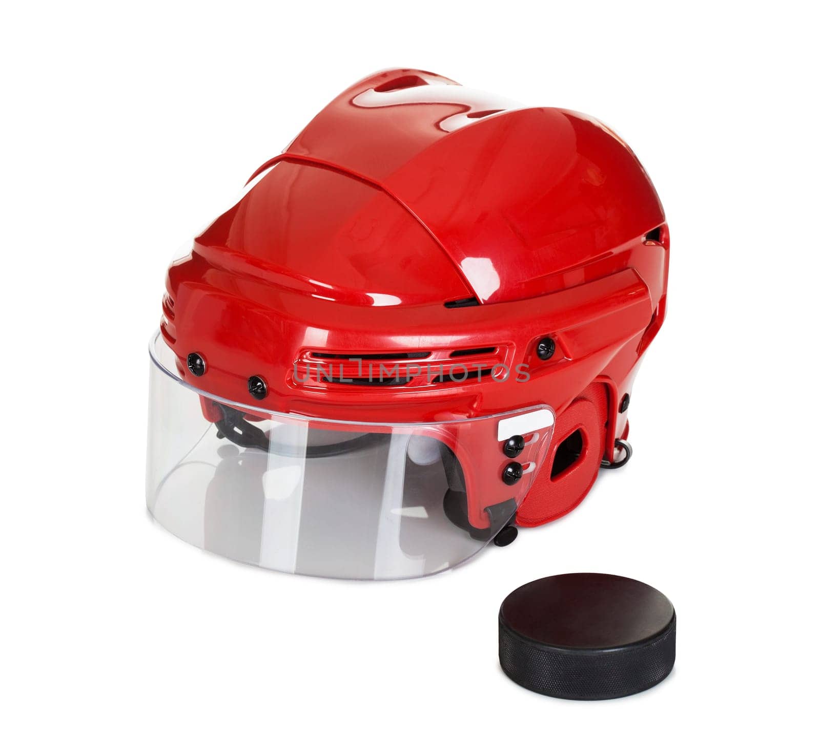 Hockey helmet and puck. Isolated on white