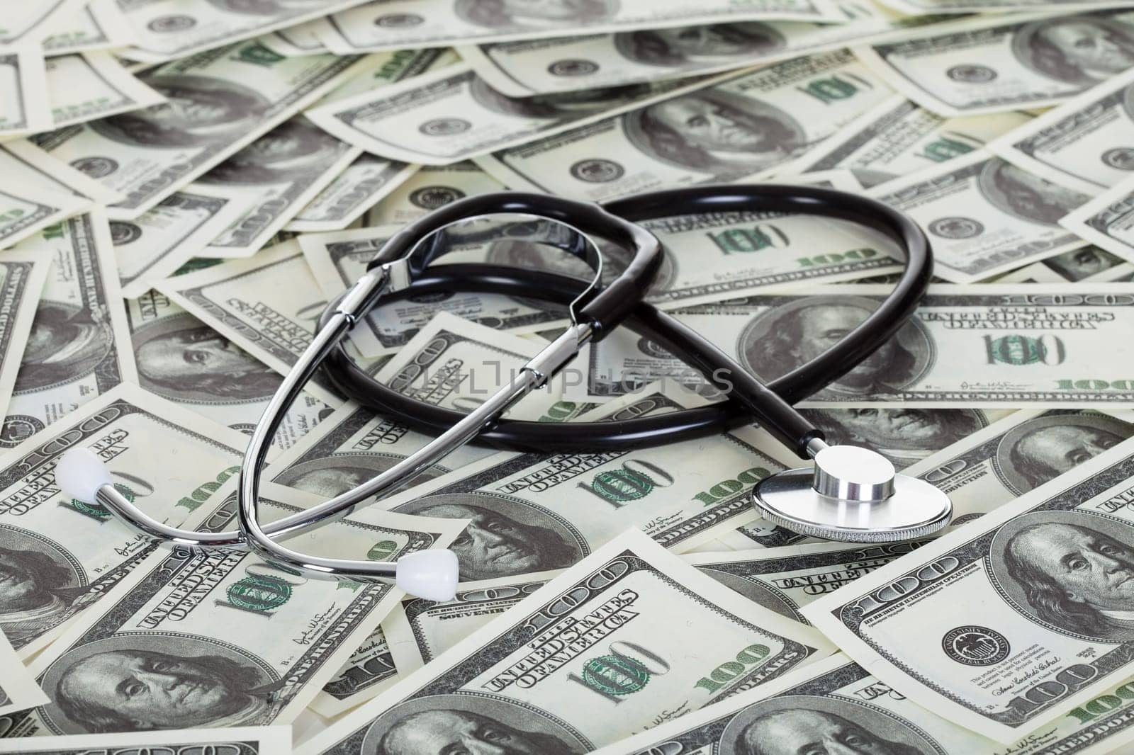 Photos of stethoscope and american dollar notes