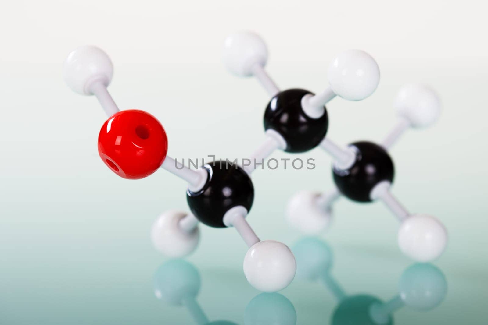 Model of molecular structure on green reflective background