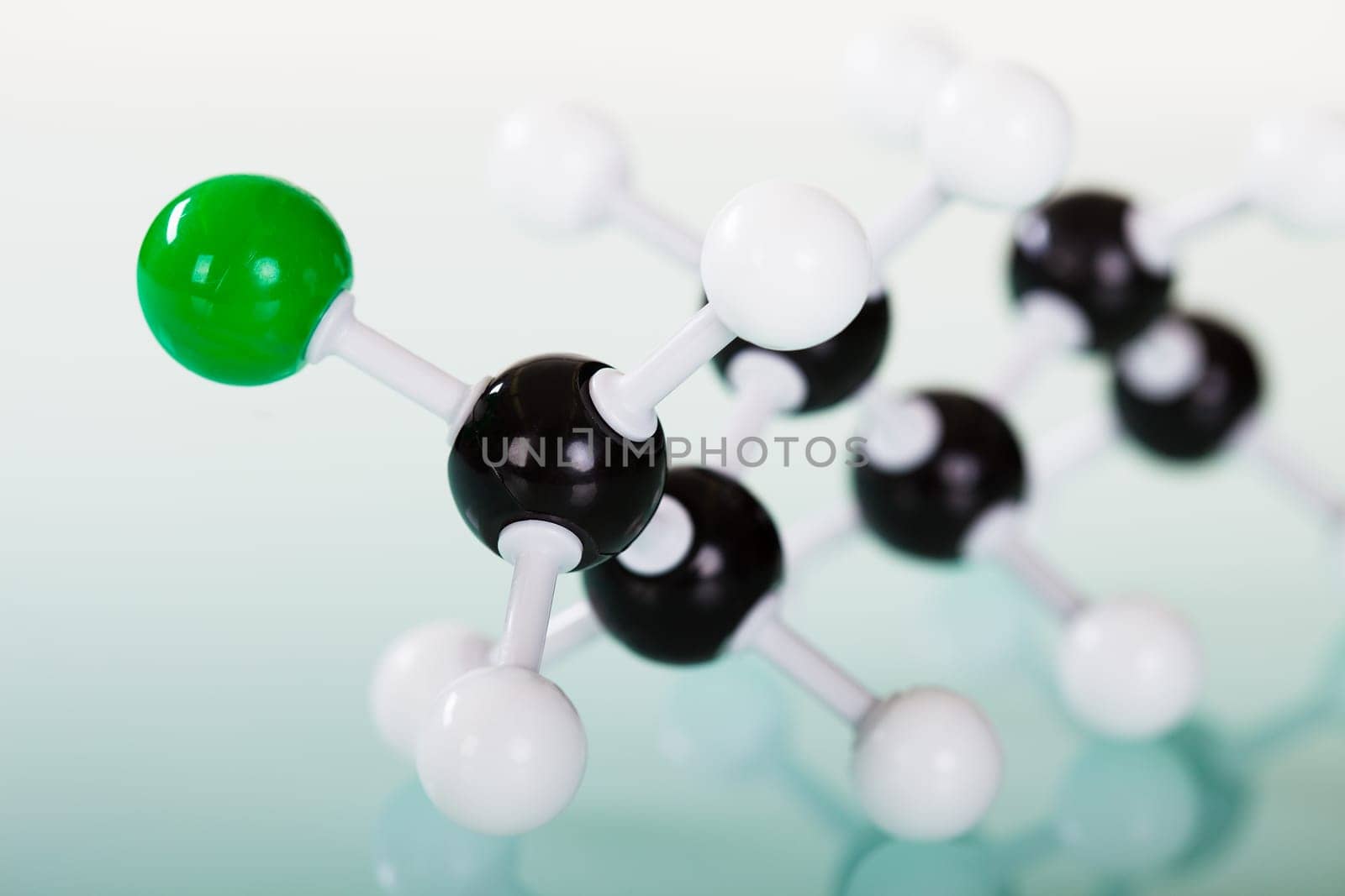 Model of molecular structure on green reflective background