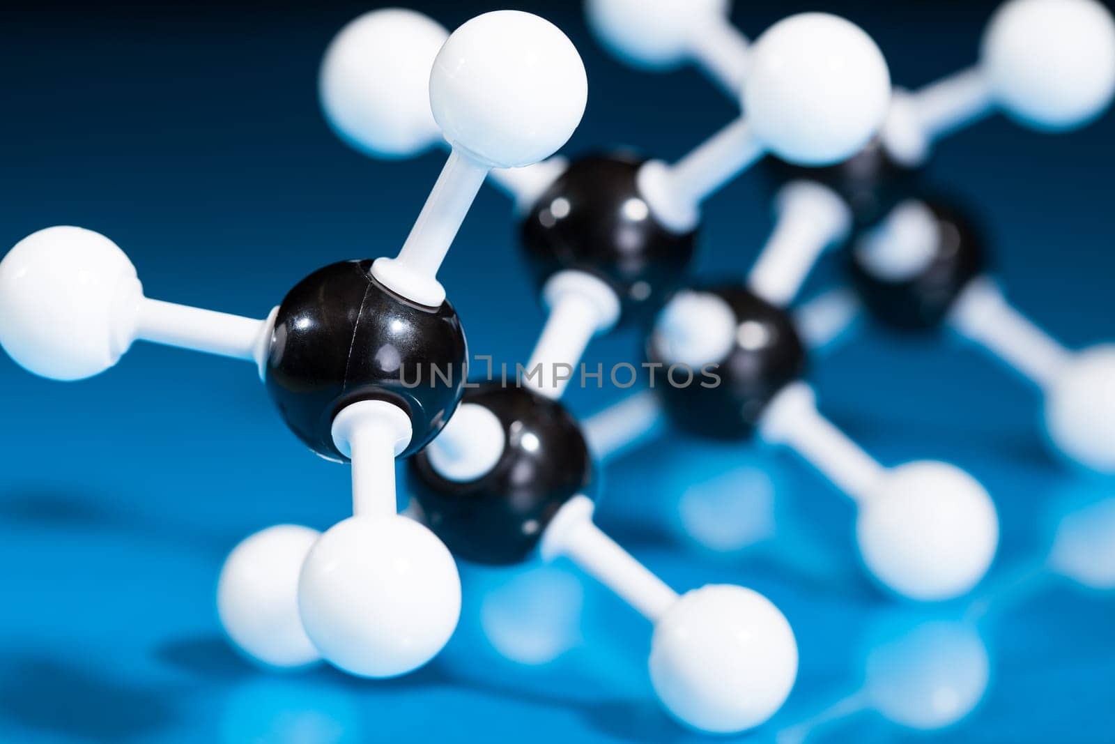 Model of molecular structure on blue reflective background