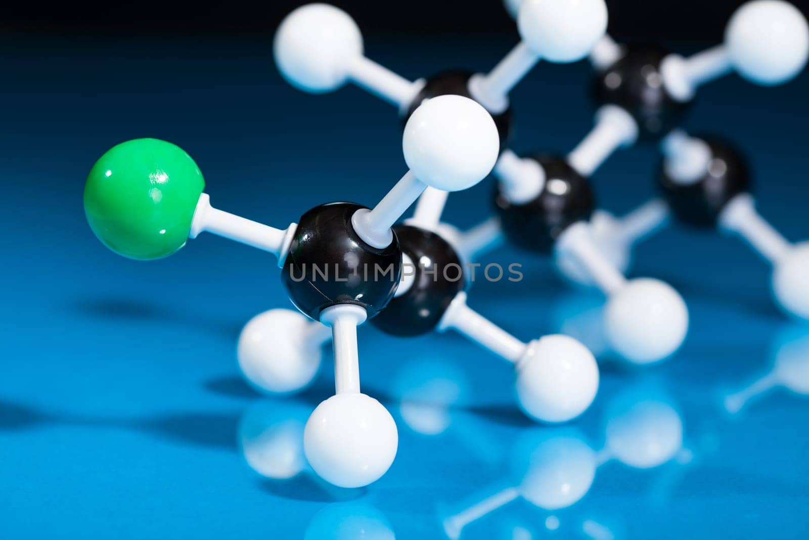 Model of molecular structure on blue reflective background