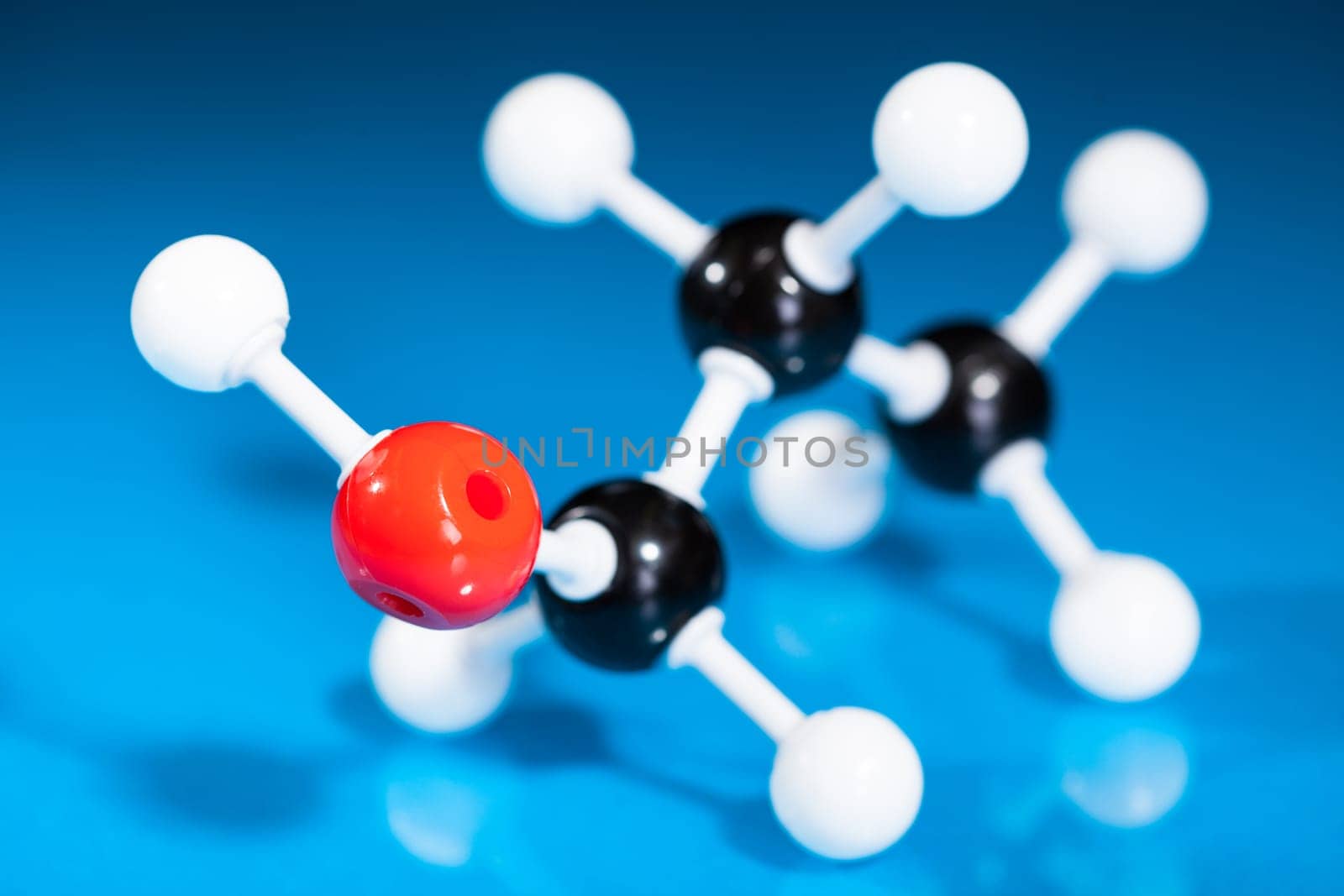 Model of molecular structure on blue reflective background