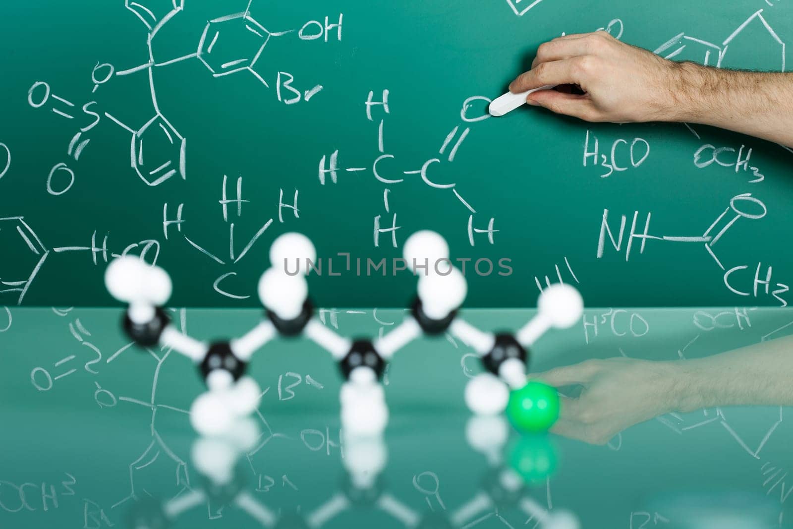 Model of molecular structure on green reflective background
