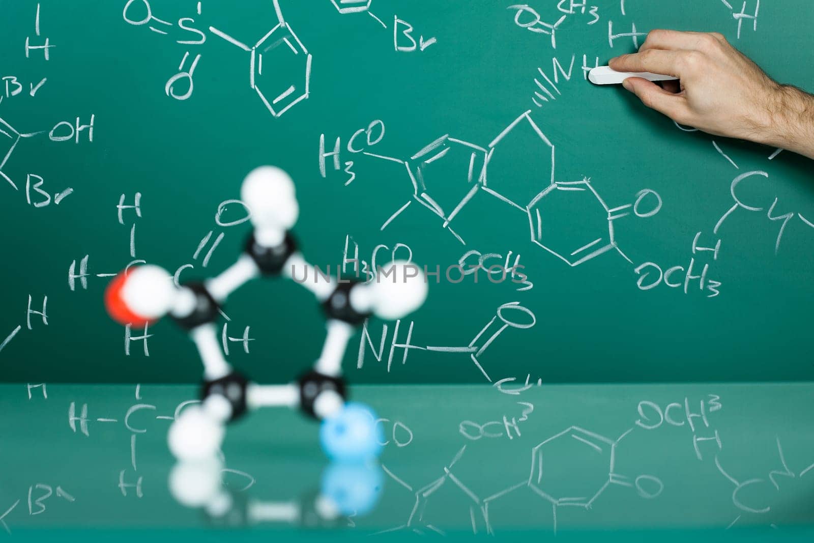 Model of molecular structure on green reflective background