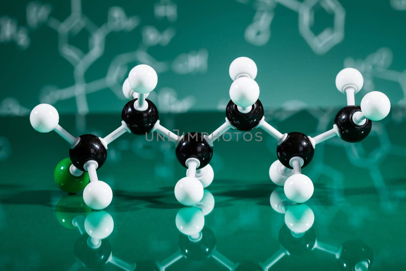 Model of molecular structure on green reflective background
