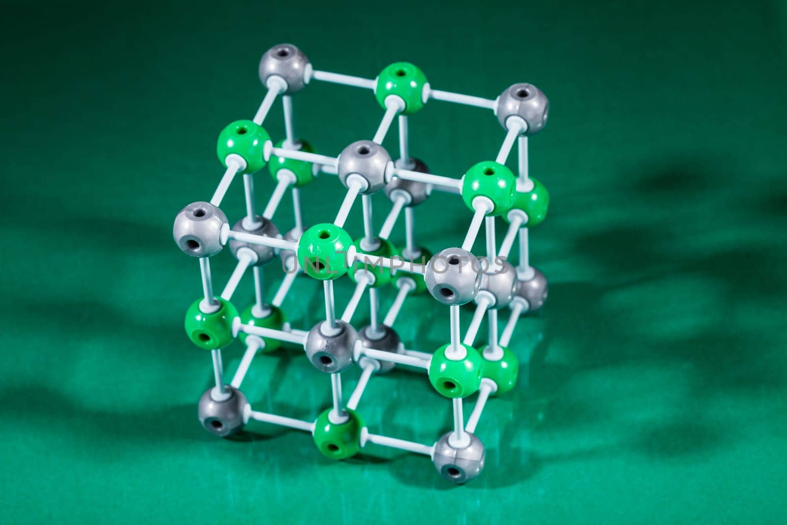 Model of molecular structure on green reflective background