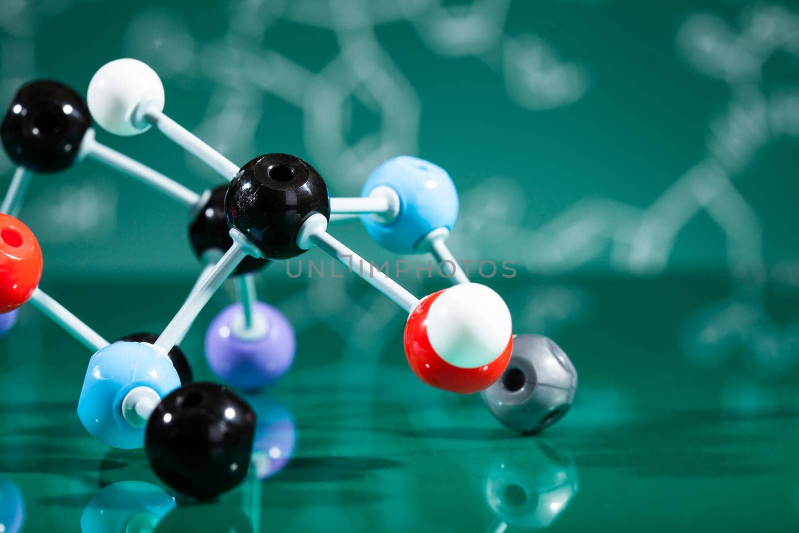 Model of molecular structure on green reflective background