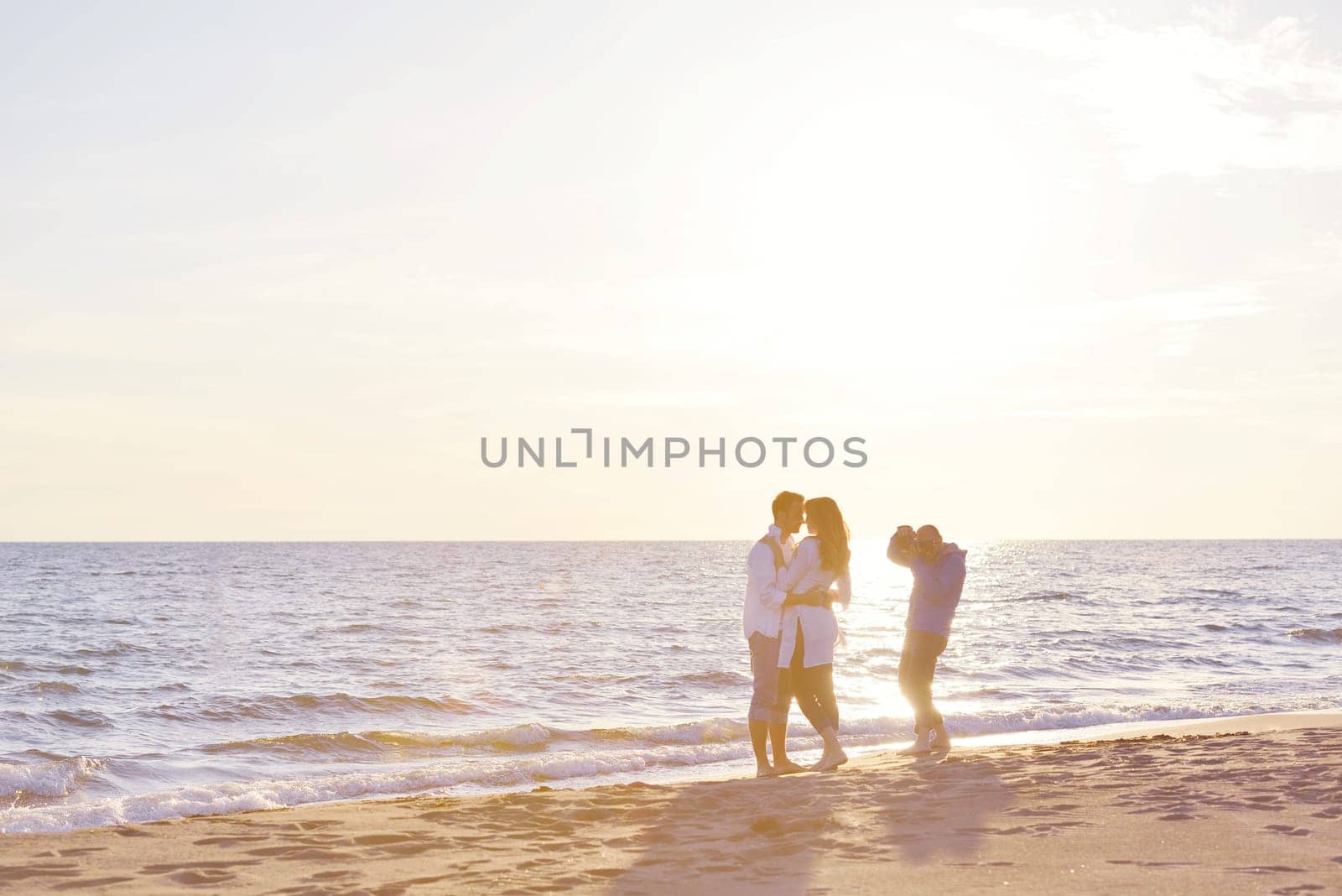 happy young romantic couple in love have fun on beautiful beach at beautiful summer day