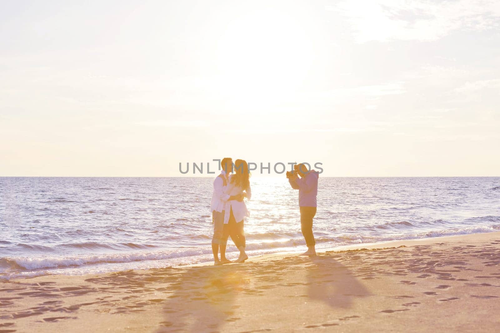 happy young romantic couple in love have fun on beautiful beach at beautiful summer day