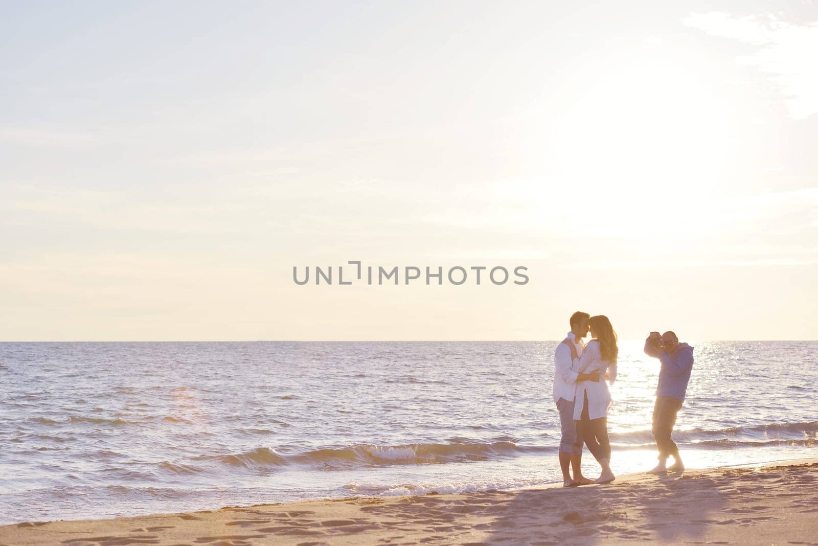 happy young romantic couple in love have fun on beautiful beach at beautiful summer day