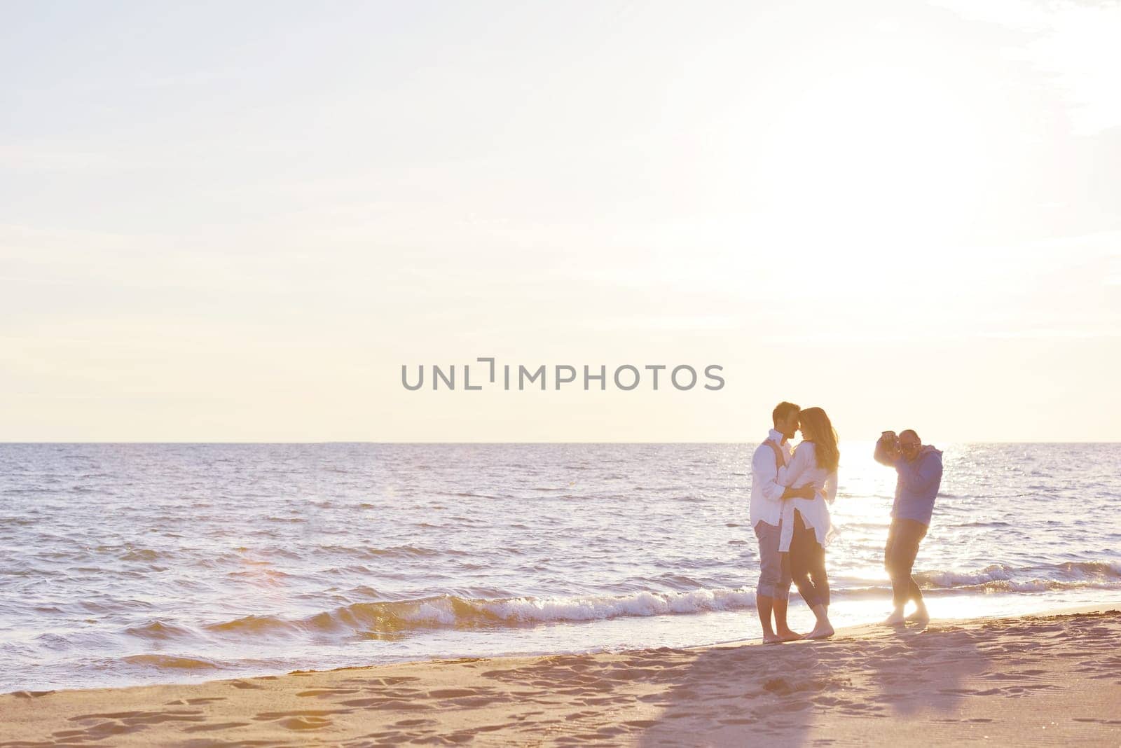 happy young romantic couple in love have fun on beautiful beach at beautiful summer day