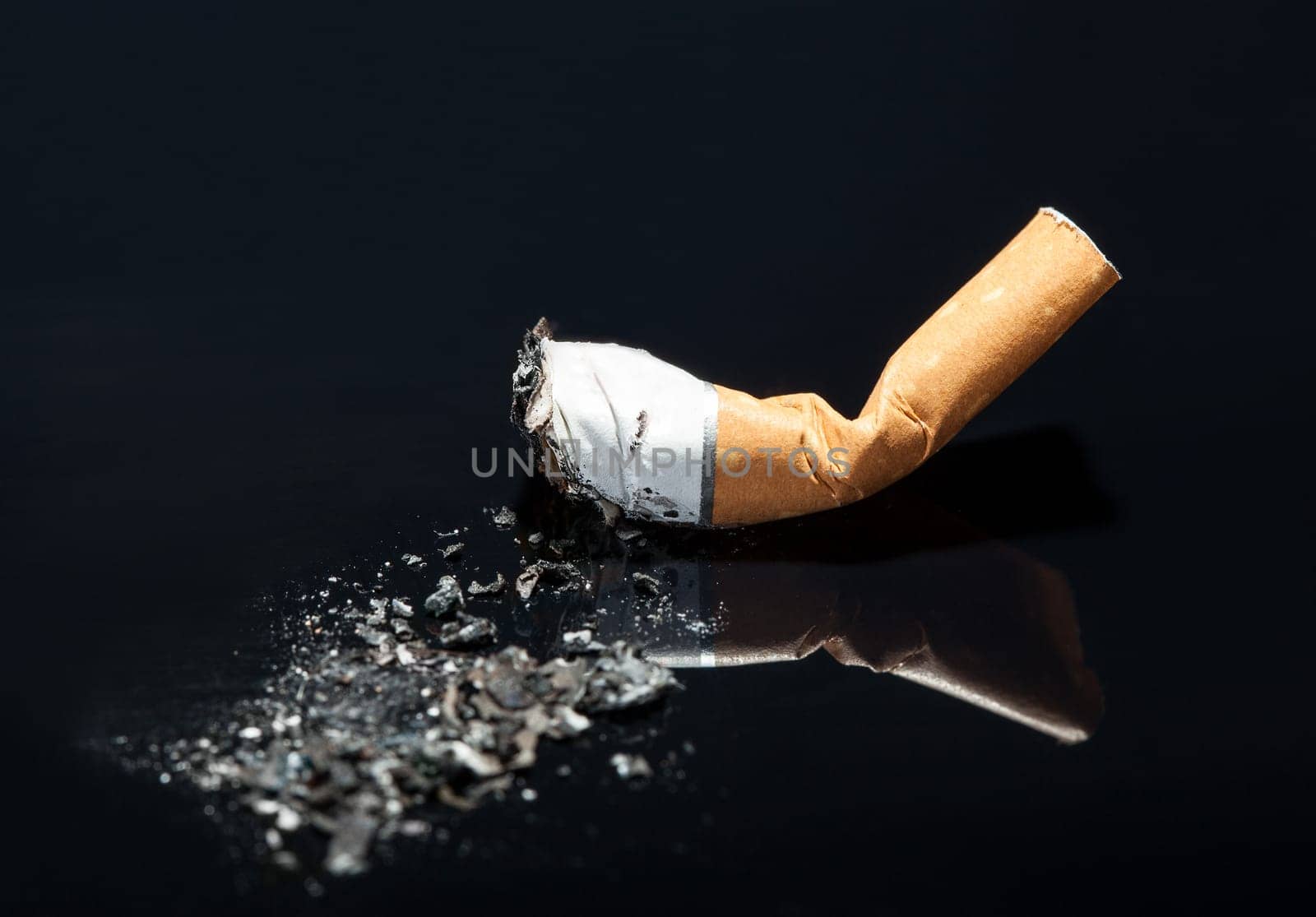 End Of Burning Cigarette Over Black Background