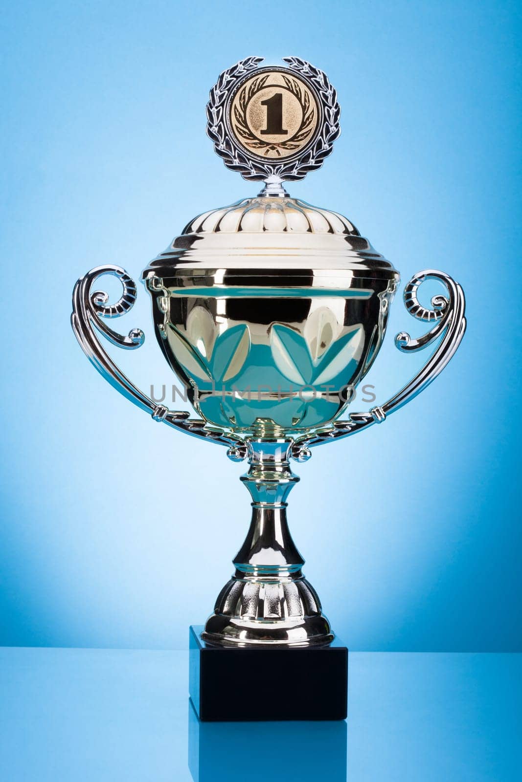 Photo Of Golden Trophy Cup Over Blue Background