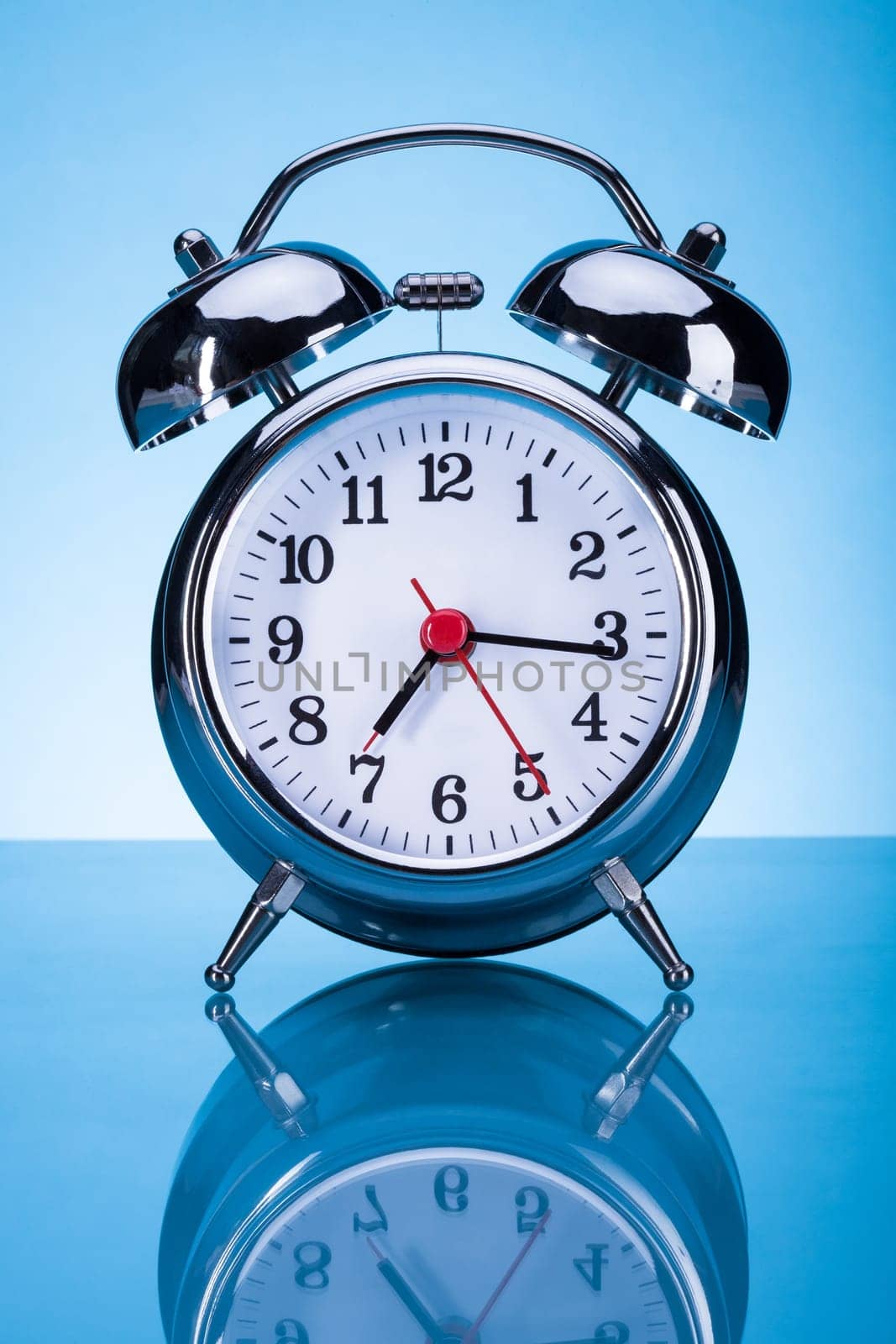 Photo Of Alarm Clock Over Blue Background