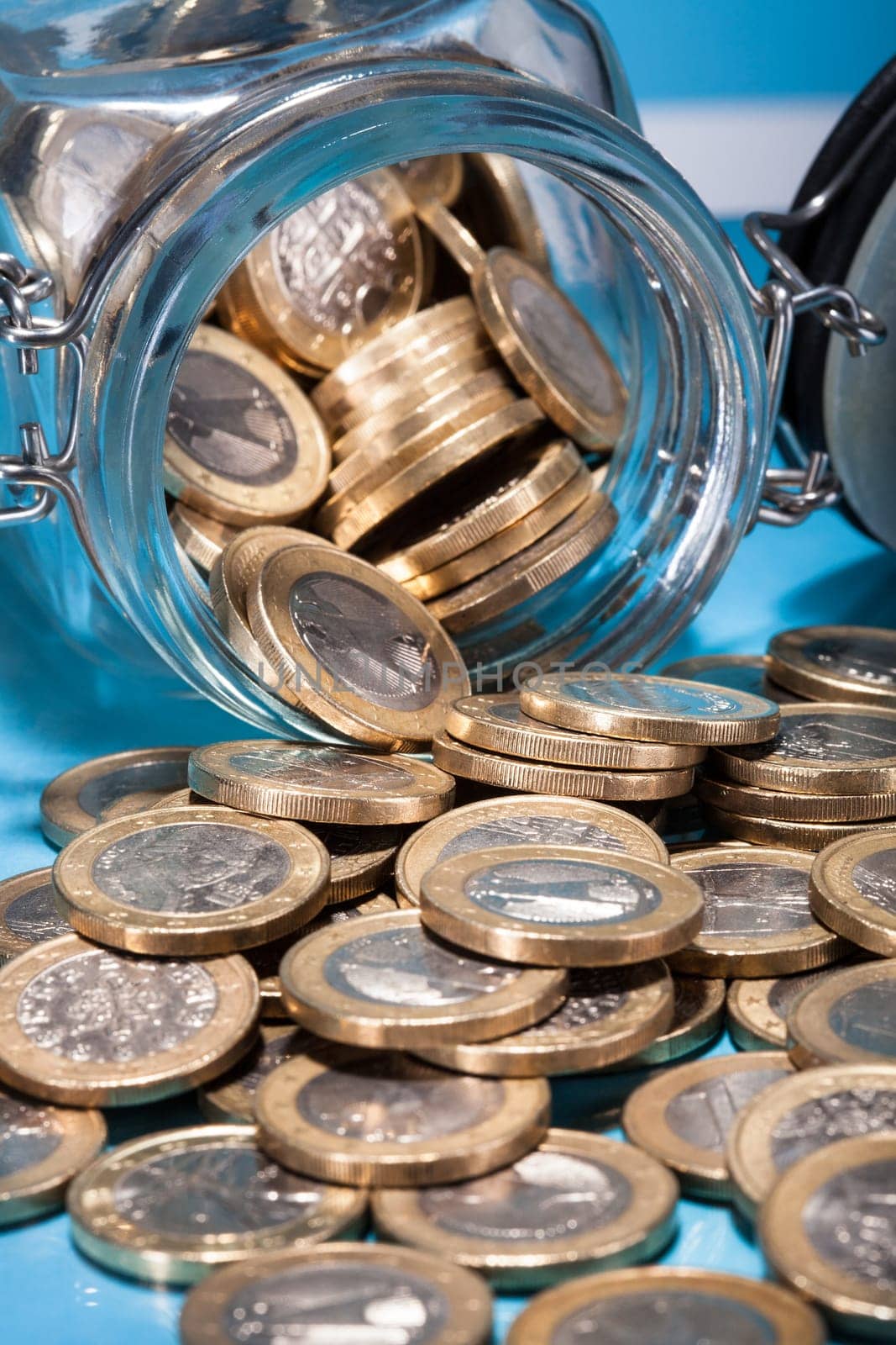 Euro Coins Spilling From A Money Jar