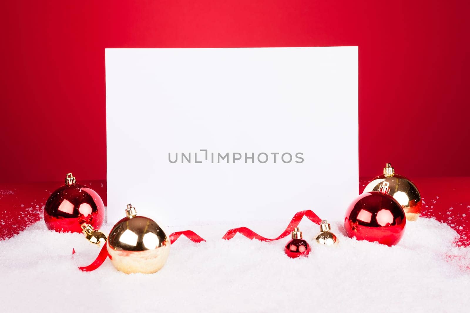 Blank Placard With Christmas Baubles On Red Background