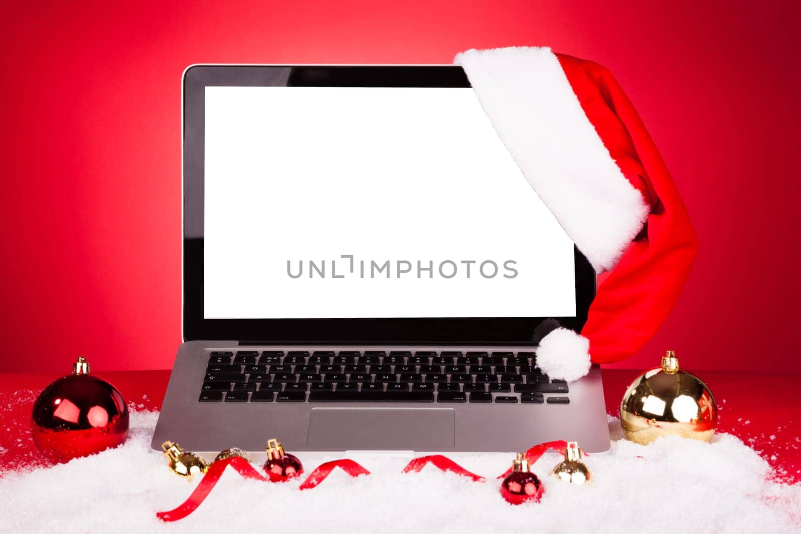 Blank Laptop With Santa Hat And Christmas Decoration