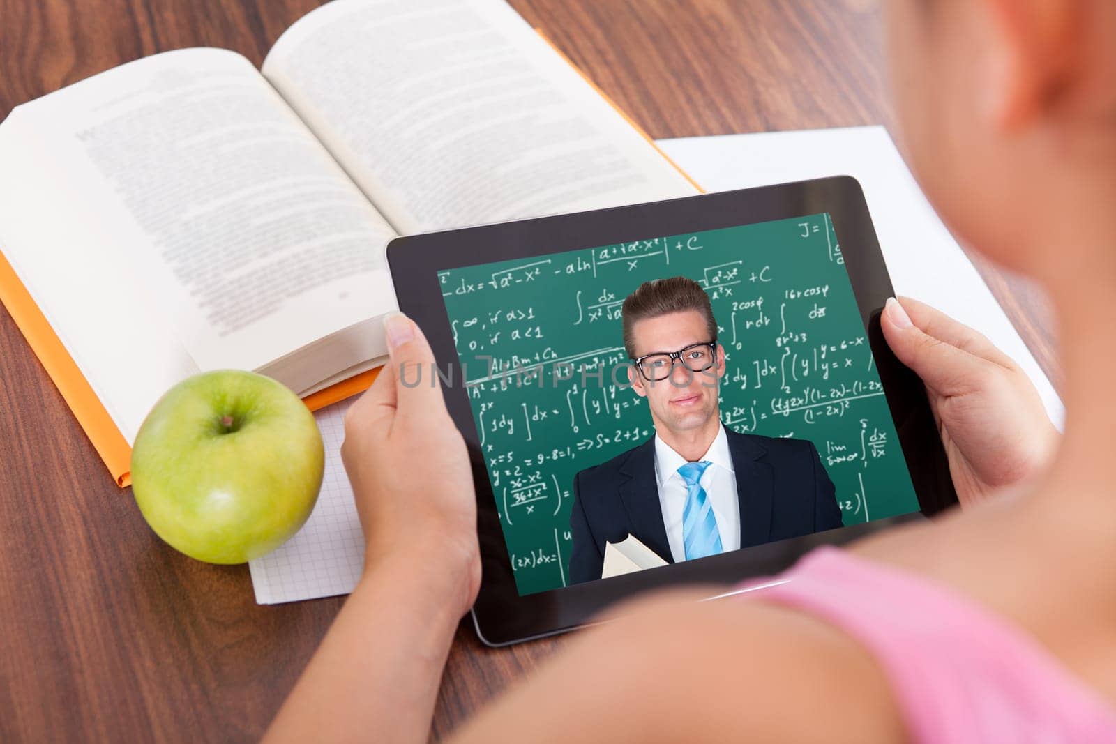 Female student watching education tutorials on digital tablet
