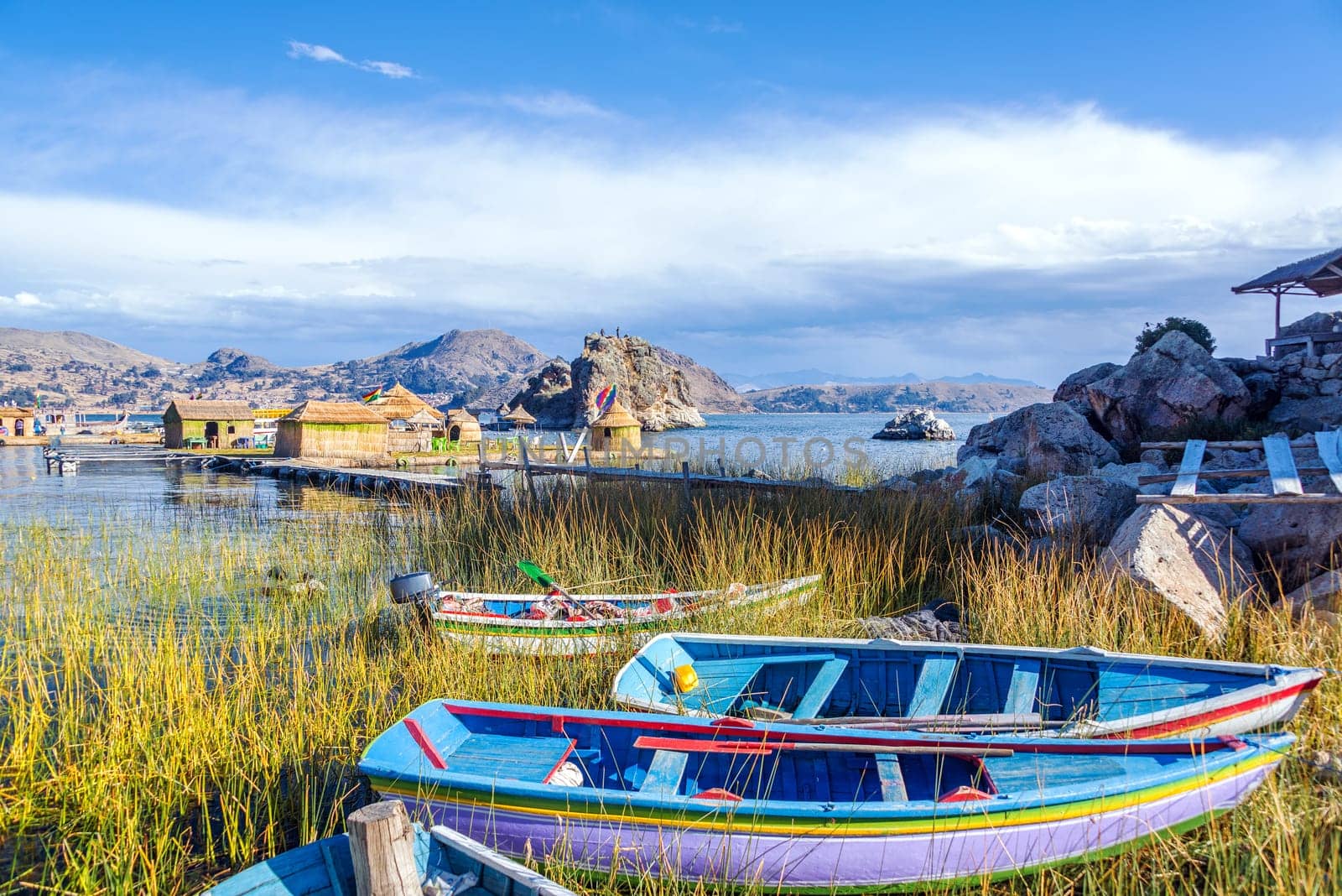 Colorful boats near floating islands on Lake Titicaca near Copacabana, Bolivia