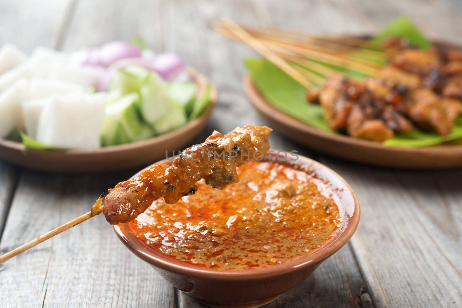 Malaysian chicken satay with delicious peanut sauce, one of famous local dishes.