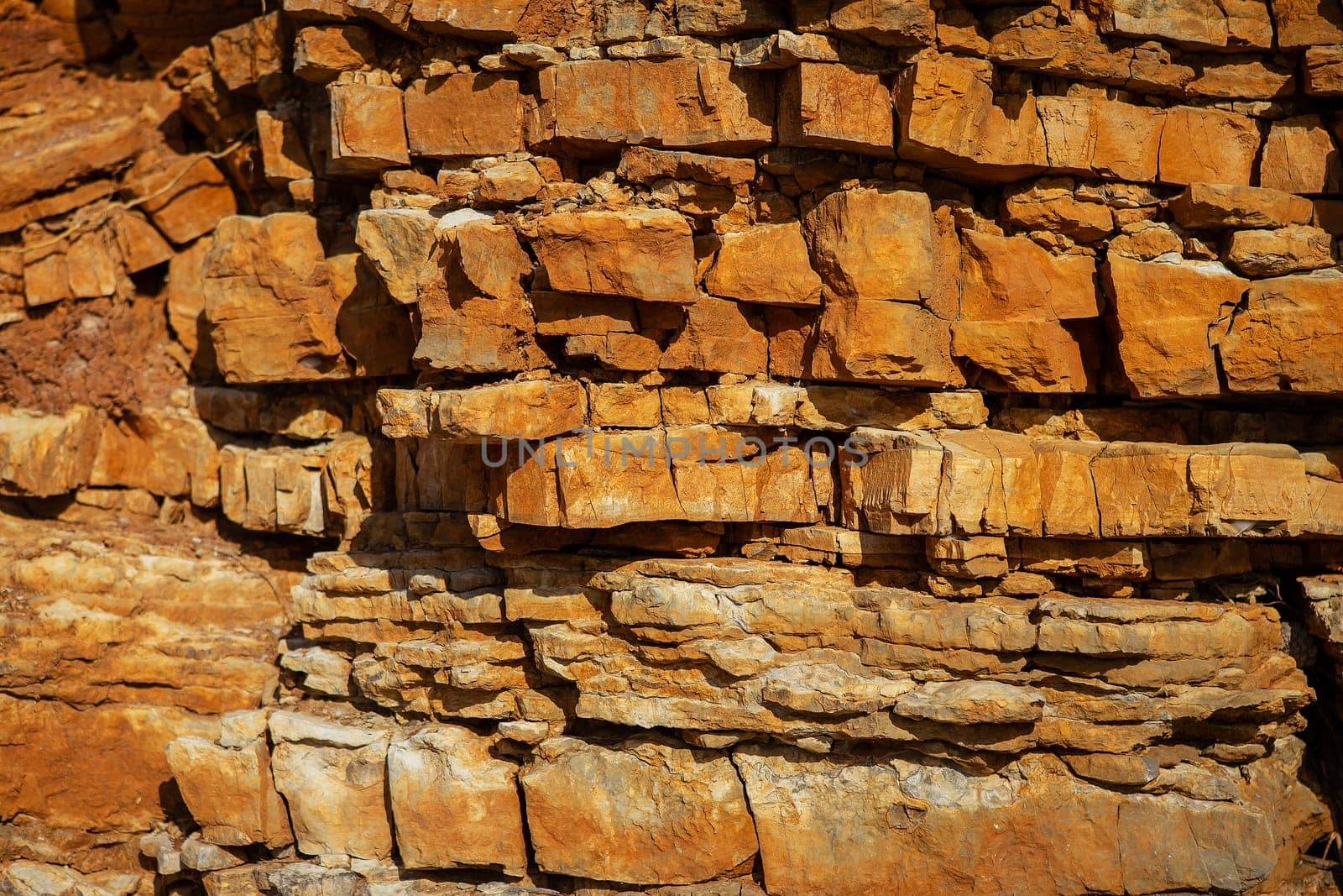 Surface, background, texture of a rock with a brownish-red tint. by sfinks