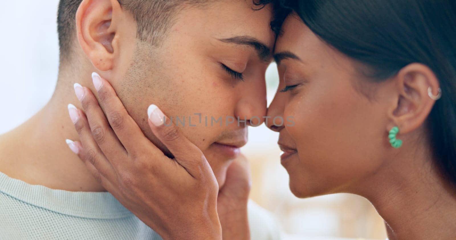 Face, love and relax with a couple closeup in their apartment together for care, romance or bonding. Trust, support or commitment with a happy young man and woman in their home on the weekend.