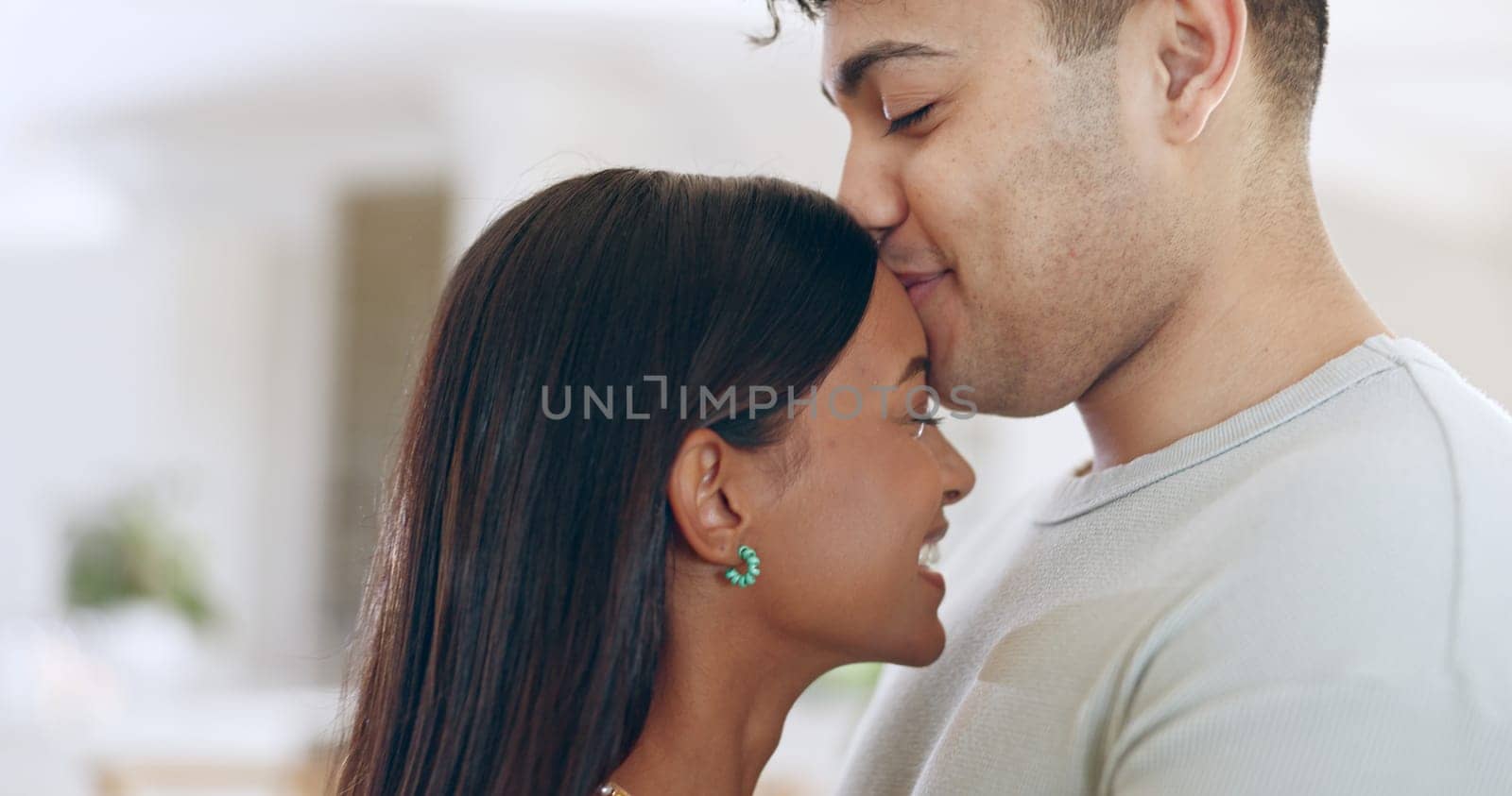 Face, love and trust with a couple closeup in their apartment together for care, romance or bonding. Relax, support or commitment with a happy young man and woman in their home on the weekend.
