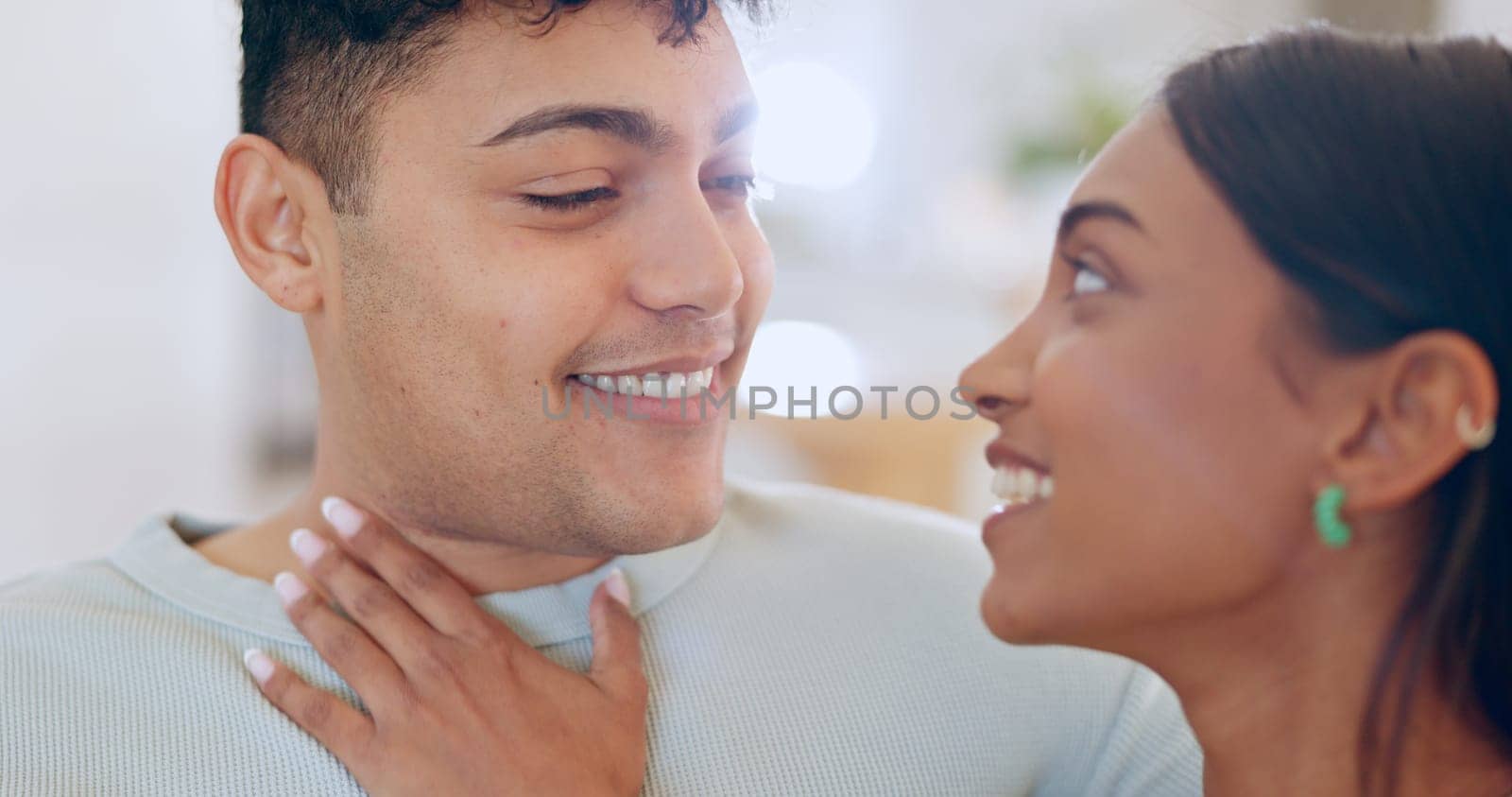 Face, love and commitment with a couple closeup in their apartment together for care, romance or bonding. Relax, support or trust with a happy young man and woman in their home on the weekend.