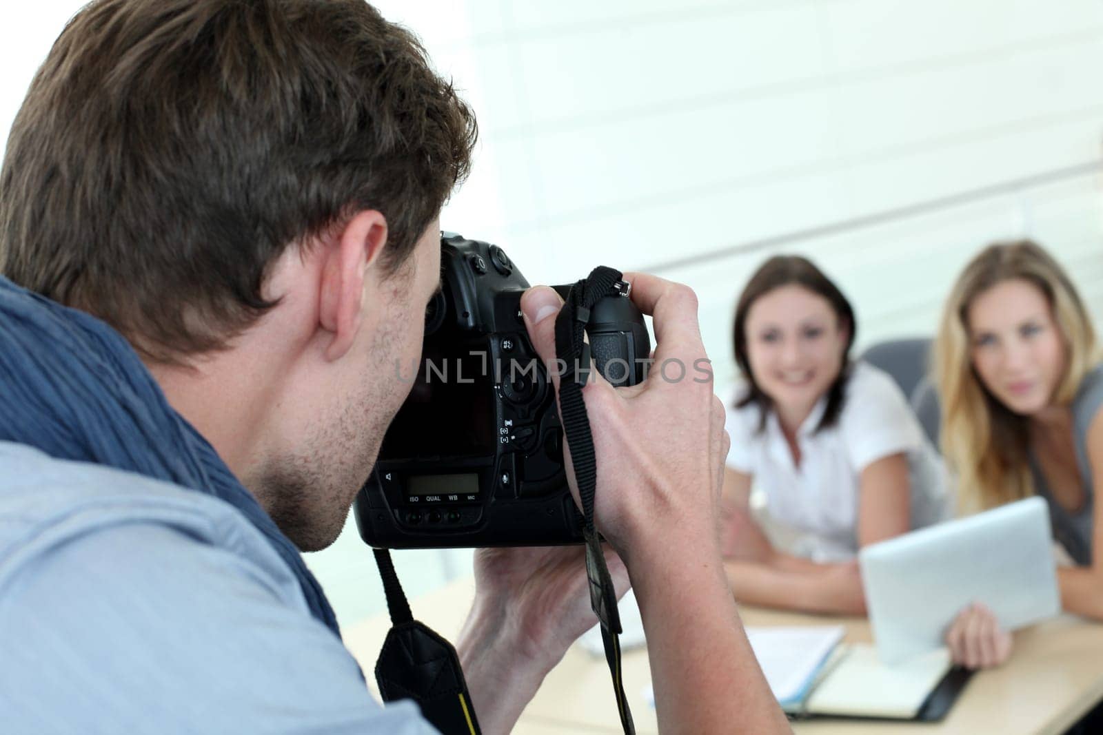 Photographer taking pictures of models