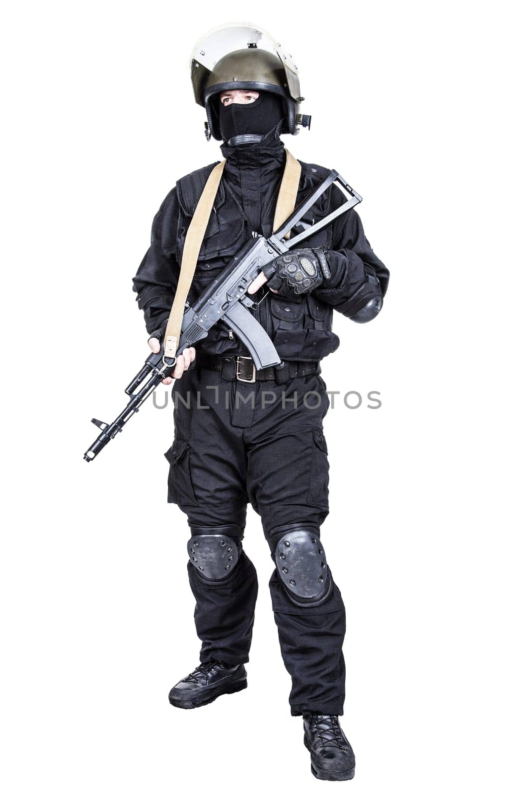 Spec ops soldier in black uniform and face mask with his rifle