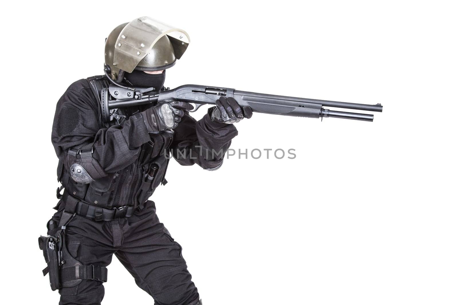 Spec ops soldier in black uniform and face mask with shotgun