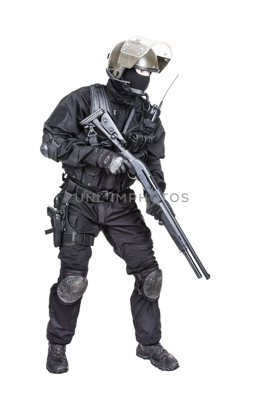 Spec ops soldier in black uniform and face mask with shotgun