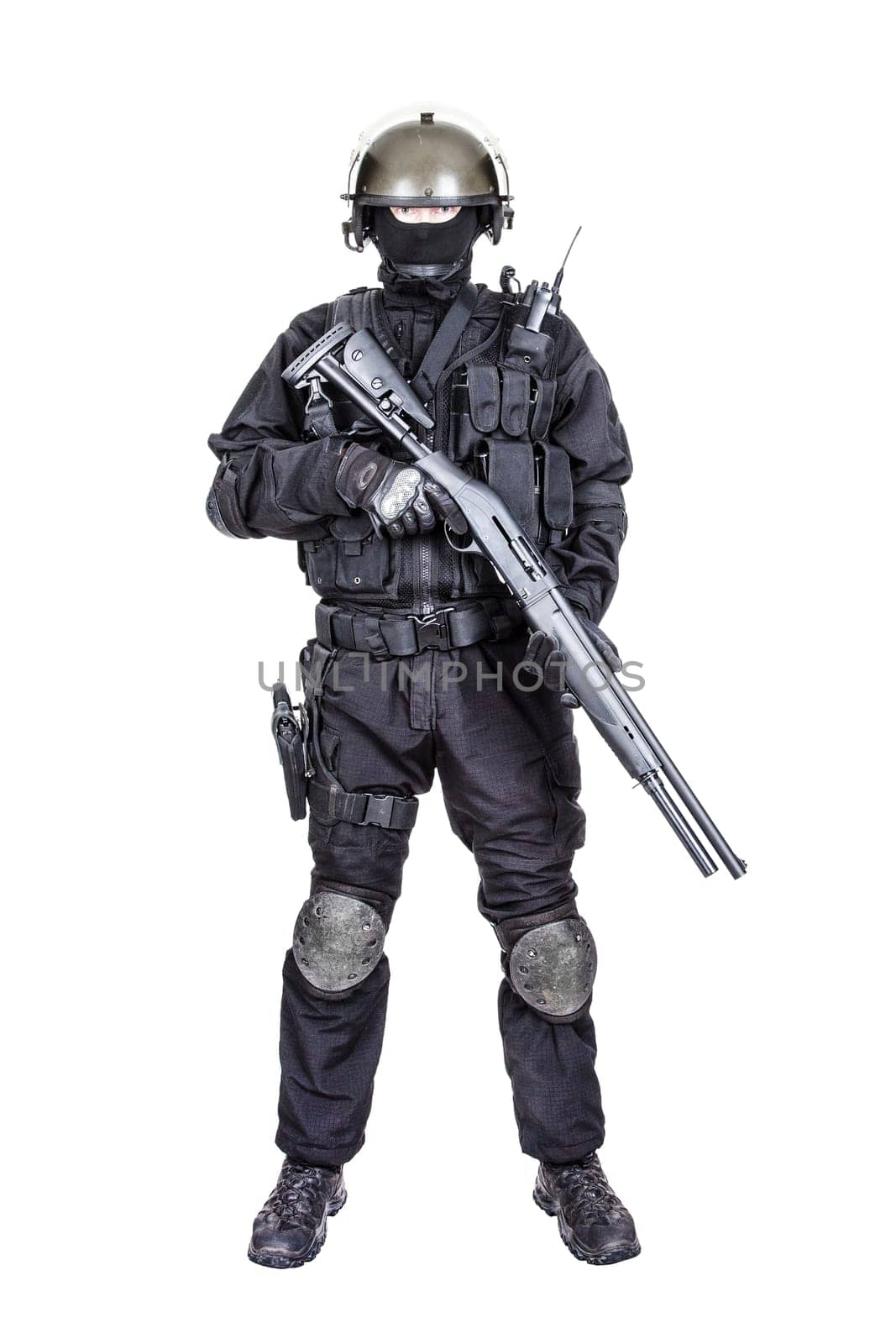 Spec ops soldier in black uniform and face mask with shotgun