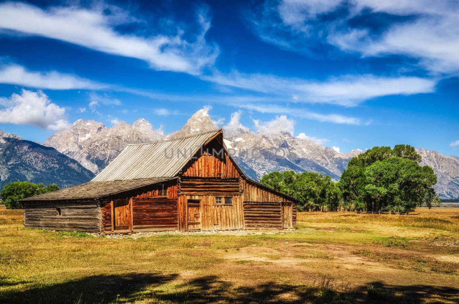 Grand Teton scenic view with abandoned barn on Mormon Row, Wyoming, USA