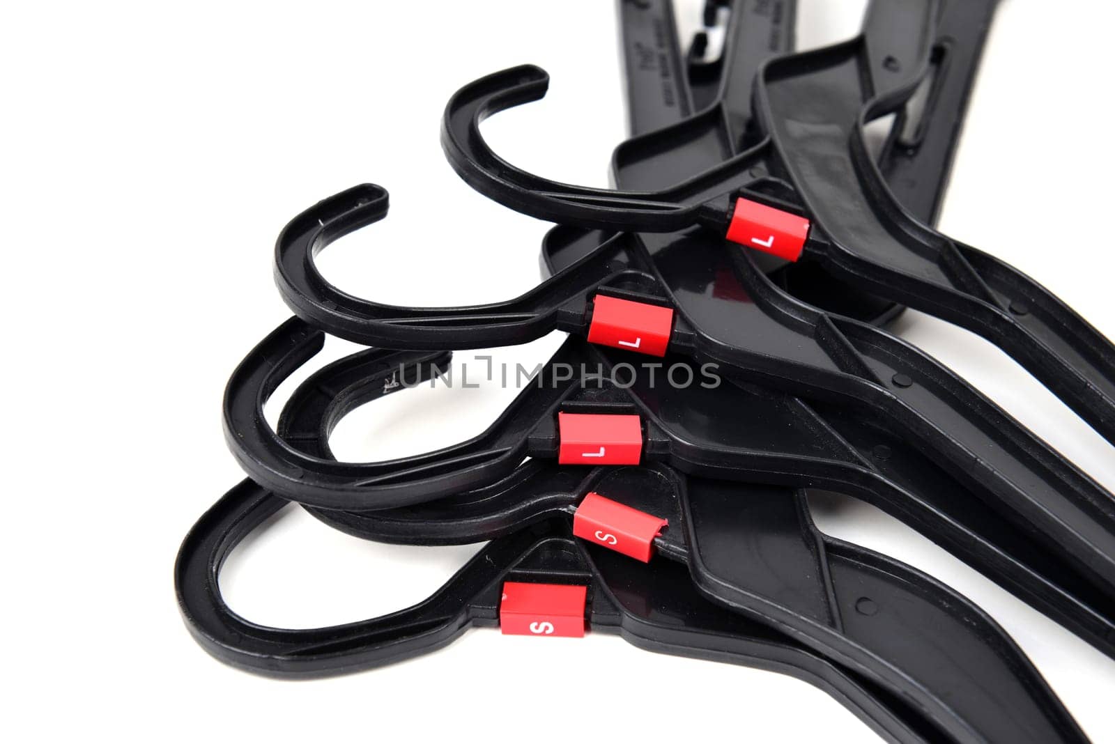 black plastic clothes hanger on white background