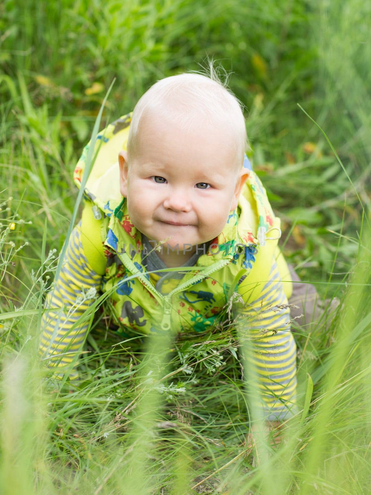 Adorable baby on green grass