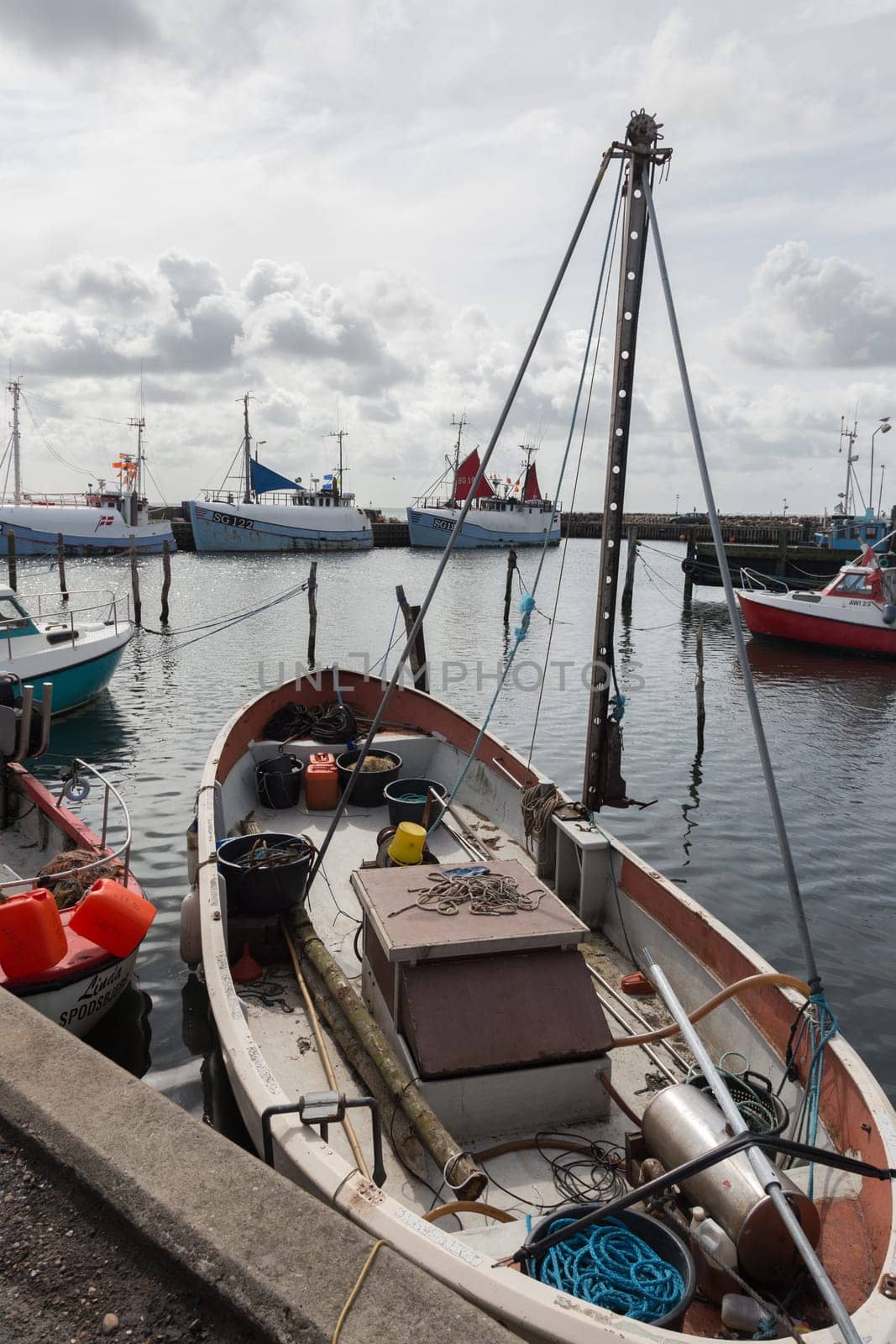 Small fishing boat with many utensils for fishing