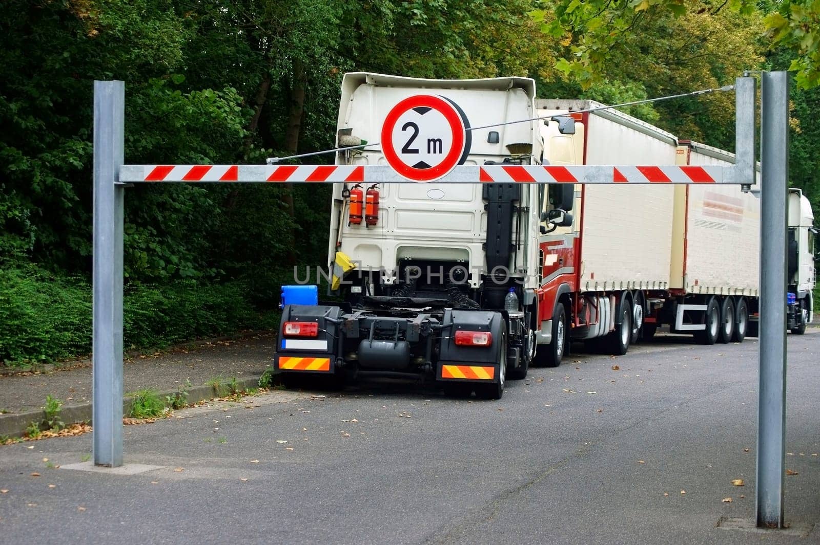 The photograph of trucks in a parking lot with one-sided navigability.