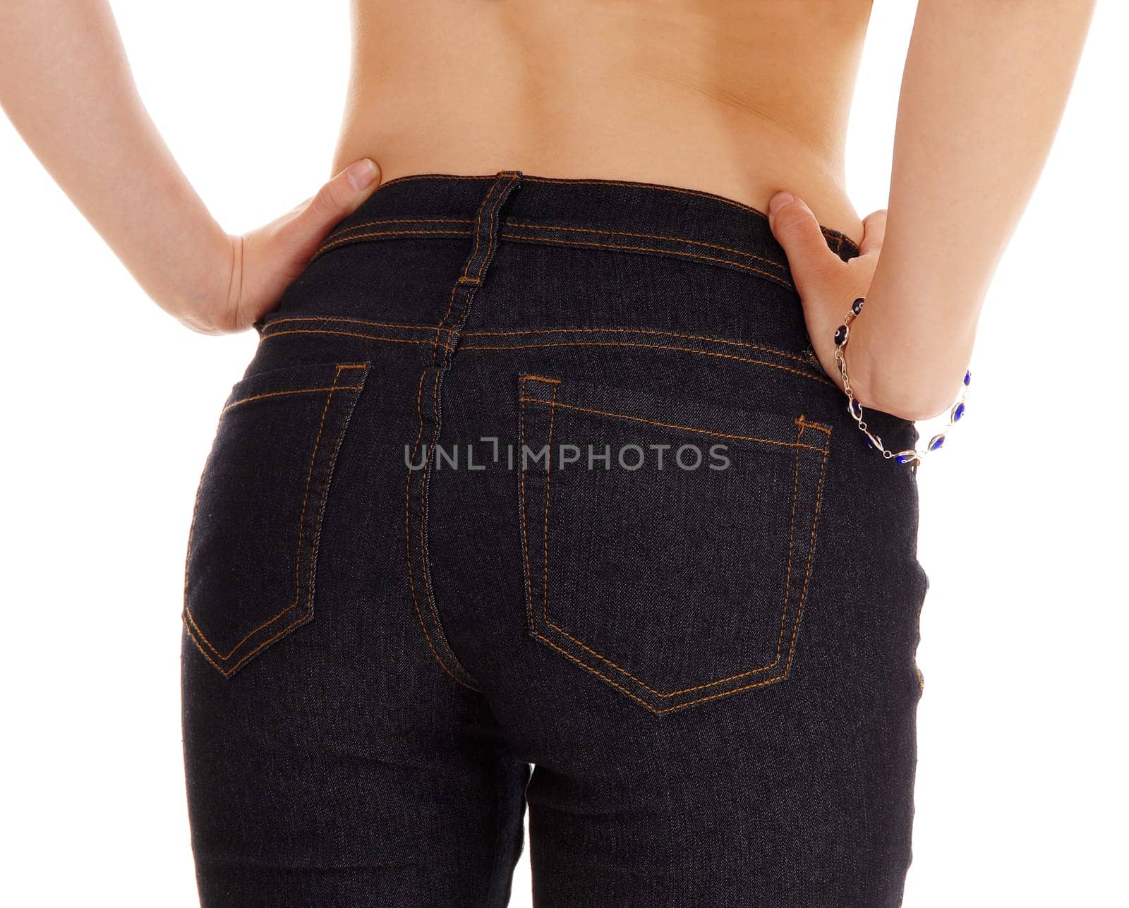 A closeup picture of the bottom of a young woman in jeans standing.from the back, isolated for white background..