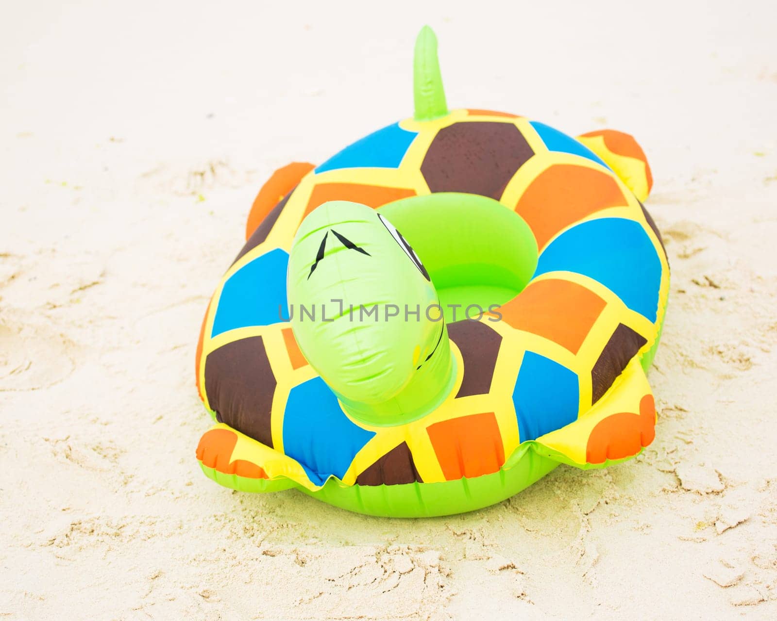 Swim ring on a white sand beach