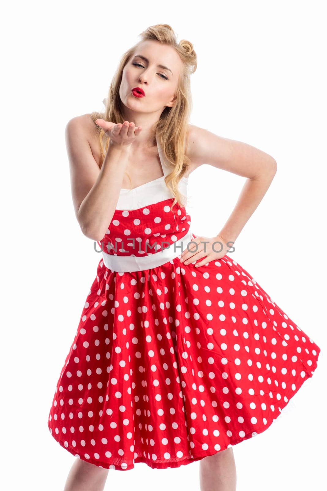 a pinup girl flirts and gives a pustekuss