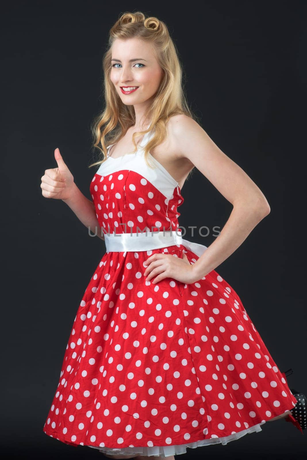 woman in summer dress shows herself successful