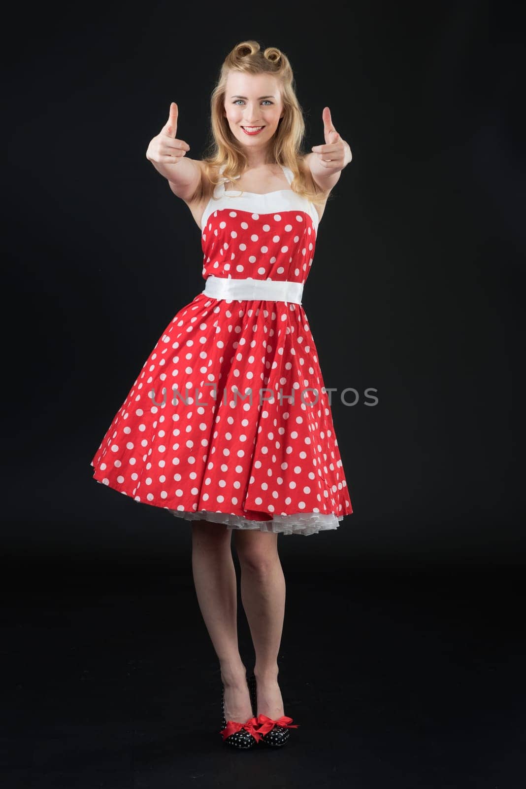 woman in summer dress shows herself successful