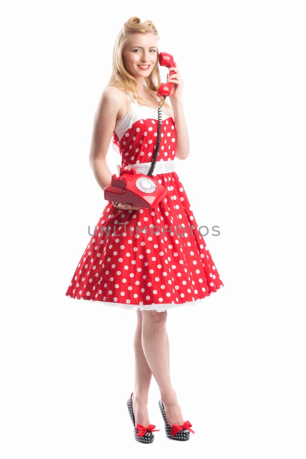 a rockabilly girl on the phone with a red phone
