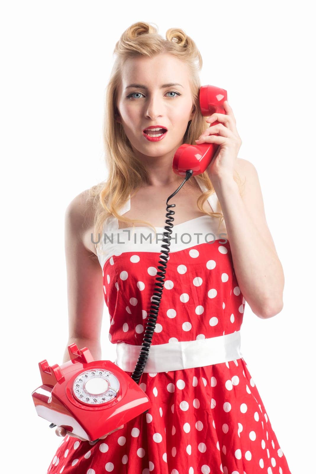 a woman in rockabilly style on the phone with a red phone