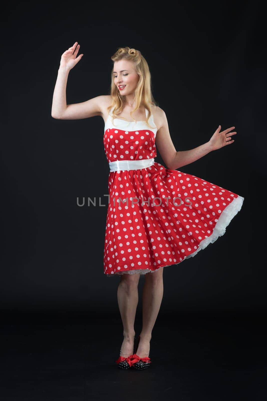 woman in summer dress shows herself successful