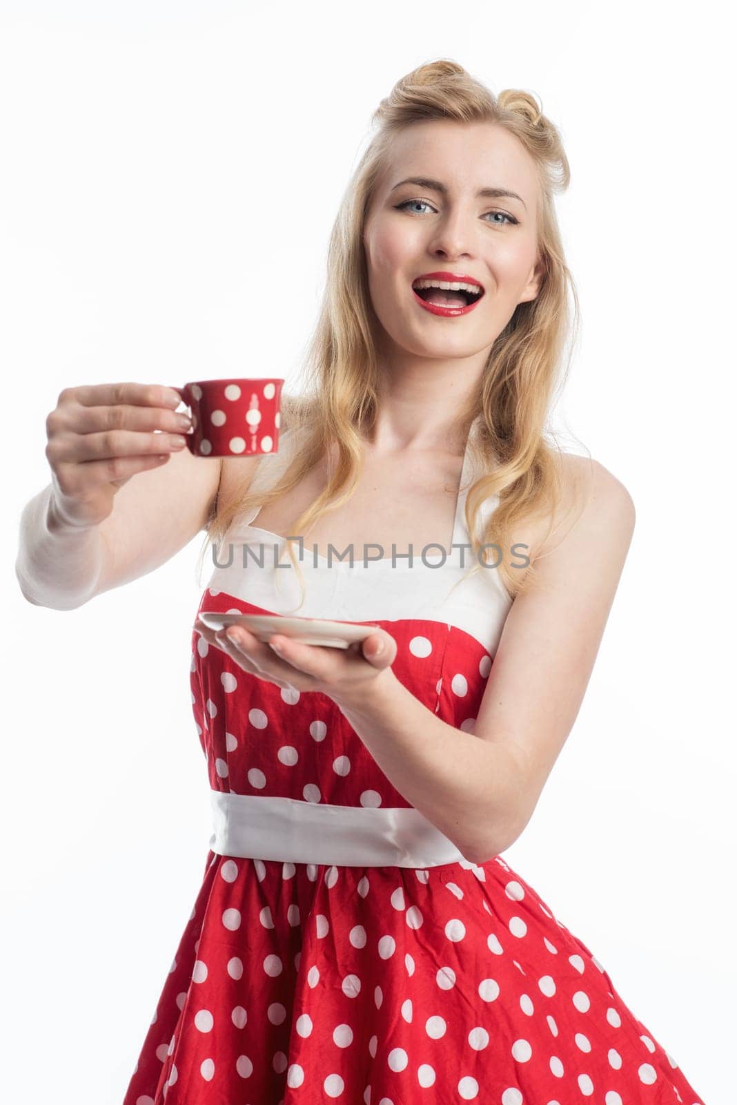 a woman in a summer dress holding a coffee cup
