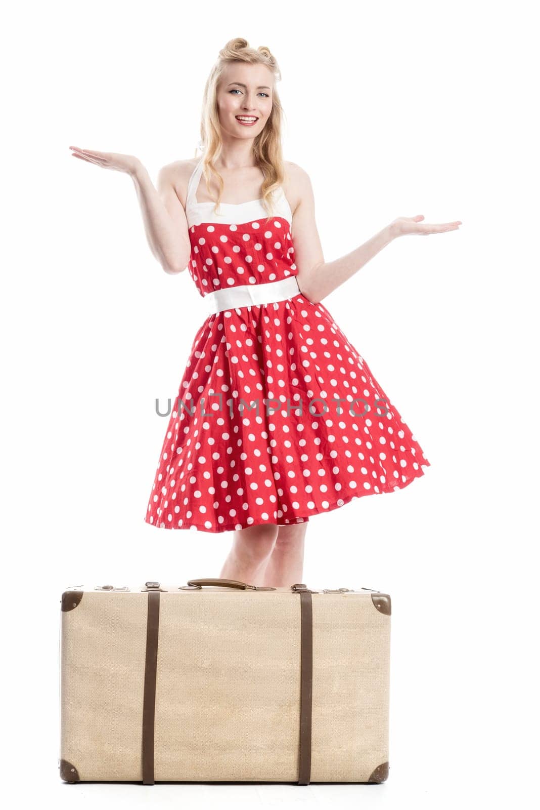 a pin up girl with suitcase gesticulated with hands